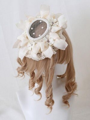 Ivory pastoral lolita hair fascinator with pearl and flower lace details, displayed on golden curly wig, rear angle view showing mesh central panel and delicate embellishments