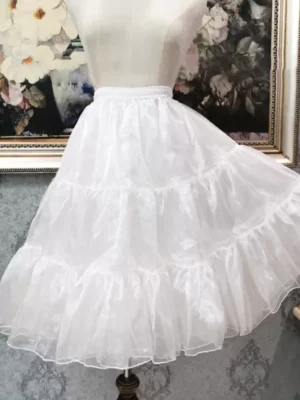 White tiered lolita petticoat underskirt three-quarter front view on dress form vintage indoor setting organza ruffled layers