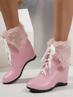 Blush pink sweet lolita wedge ankle boots front three-quarter view with white laces and fluffy pink plush fur cuff ankle trim model legs