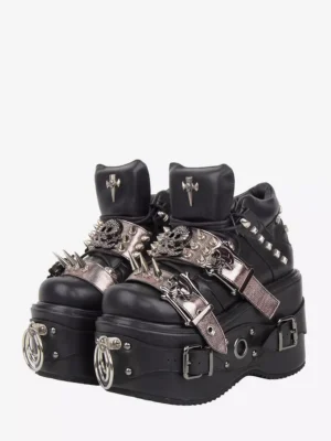Gothic Lolita platform wedge pumps front three-quarter view featuring black PU leather with metal spike studs and skull buckles on white background