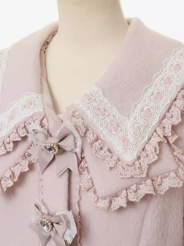 Close-up detail of sweet lolita coat double-layer lace sailor collar with gem-embellished bow brooches