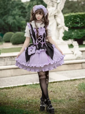 Full front view of purple Gothic Lolita cosplay dress styled with black platform boots and fishnet stockings on outdoor lawn with stone sculpture