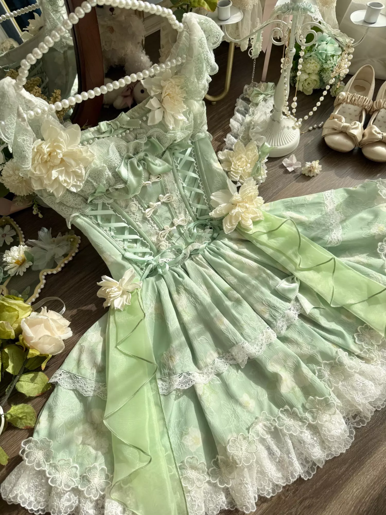 Enchanted garden lolita fairy dress fabric detail showing polyester quality floral lace texture and construction craftsmanship