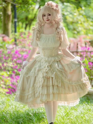 Apricot Hime Classic Lolita dress with square neckline, short puff sleeves, and multi-layered ruffled skirt—front full-body view on model in outdoor garden setting