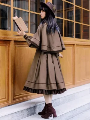 Back view of coffee brown embroidered gothic lolita dress showing cascading ruffled hemline, pleated skirt design, and structured bodice detail worn with maroon boots