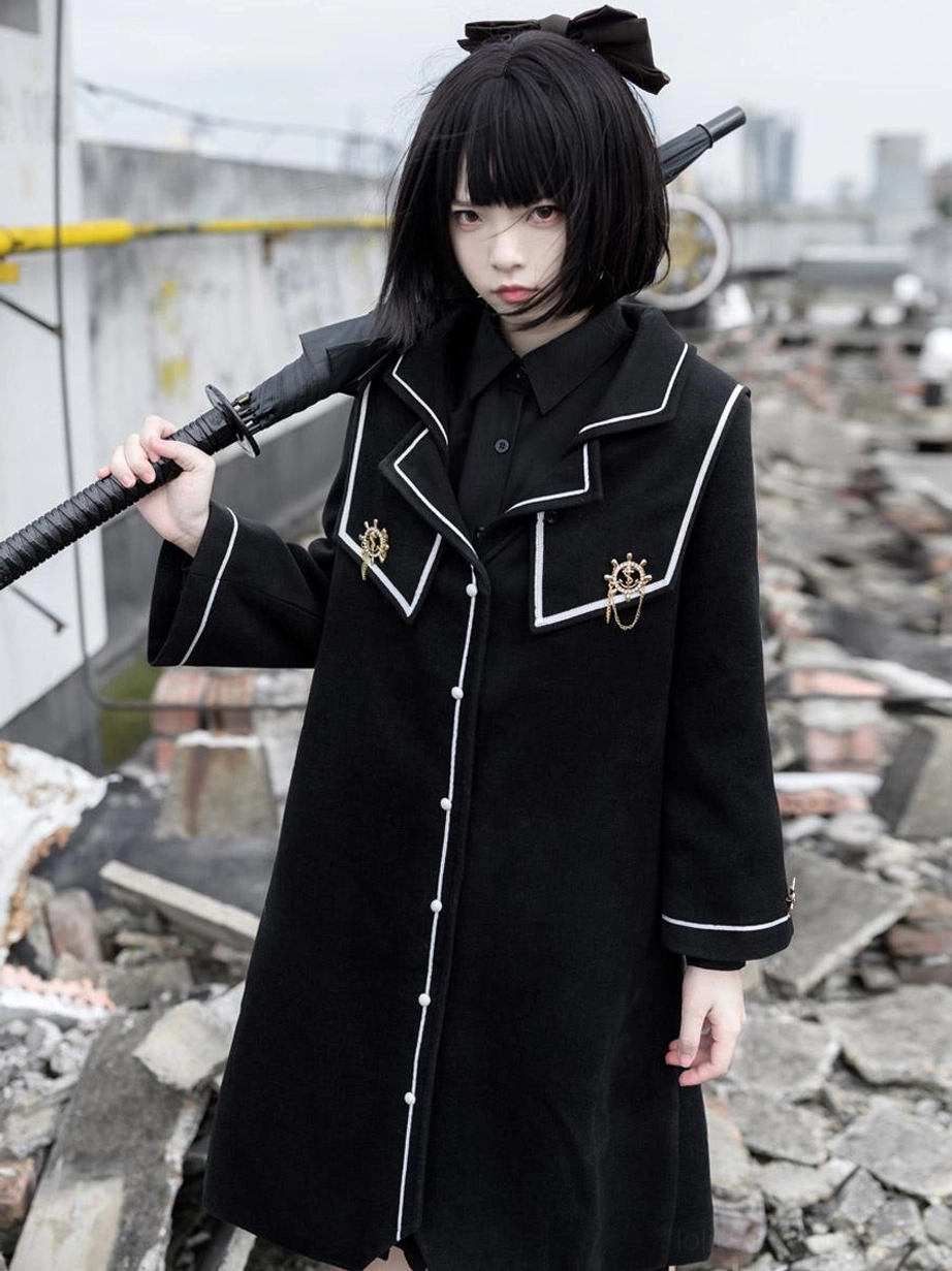 Academic lolita black coat front left full-body view long polyester overcoat with military style trim white collar cuff embroidery and metal badges
