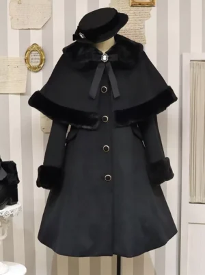 Black Academic Lolita cape coat front view with faux fur trim, gold buttons, and decorative bow details on mannequin display