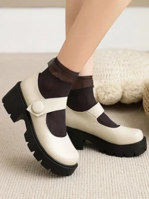 Ecru white academic lolita mary jane pumps with black lug sole, side low-angle view featuring round toe and single strap buckle with sheer black socks