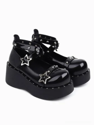Black patent leather wedge heel lolita shoes front three-quarter pair view with silver star buckles and studded ankle straps on white background