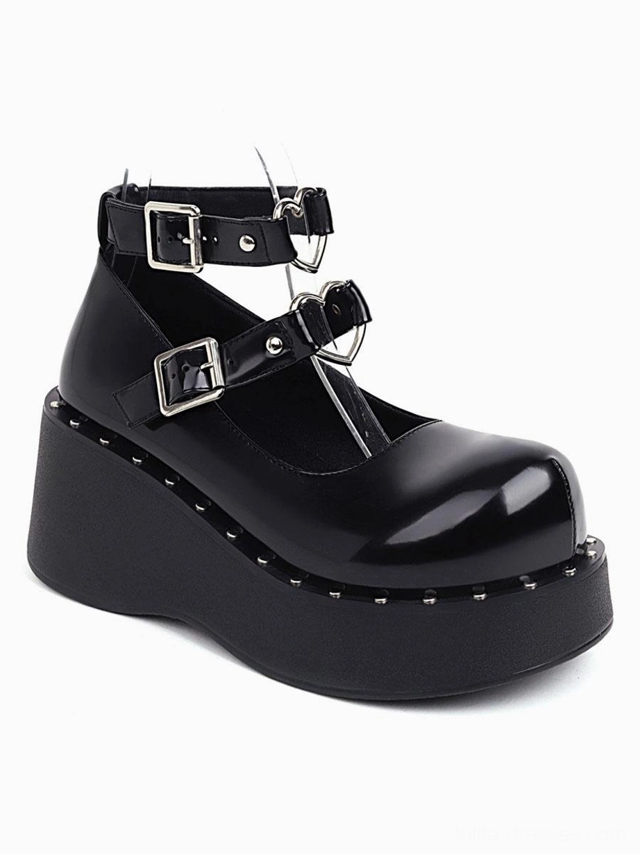 Black patent leather lolita shoes side three-quarter single view dual silver buckle ankle straps smooth leather surface