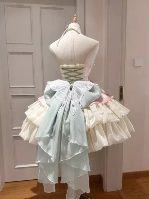 Apricot Fairy Lolita JSK dress back view showcasing dramatic powder blue chiffon bow train, lace-up corset back closure, tiered ruffled skirt construction with coordinating trim details on dress form