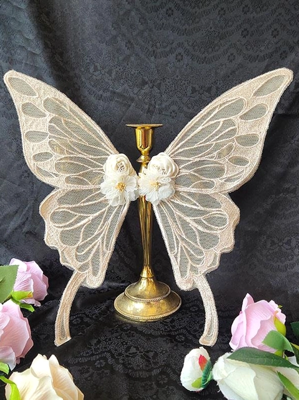 Light apricot embroidered lace butterfly hair accessory with textured wings white flower center and apricot velvet tail straps - warm pastel lolita headwear