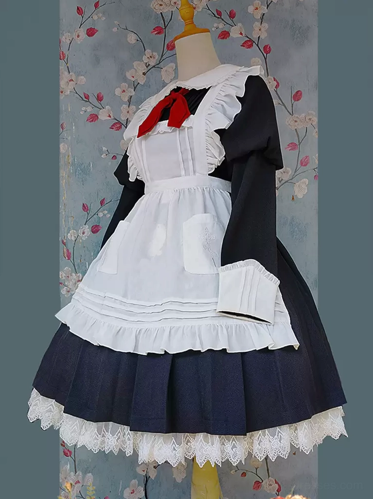 Apricot lolita apron three-quarter front view on dress form showing waist pouch and left apron pocket with floral wallpaper