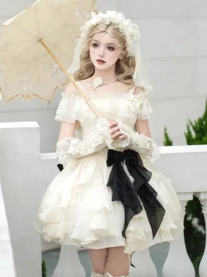 Apricot sweet lolita dress with off-shoulder ruffled skirt, black back bow, and lace headwear, model holding vintage lace parasol