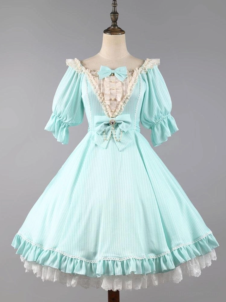 Aqua mint green short sleeve sweet lolita dress on mannequin with puff sleeves and ruffled lace hem