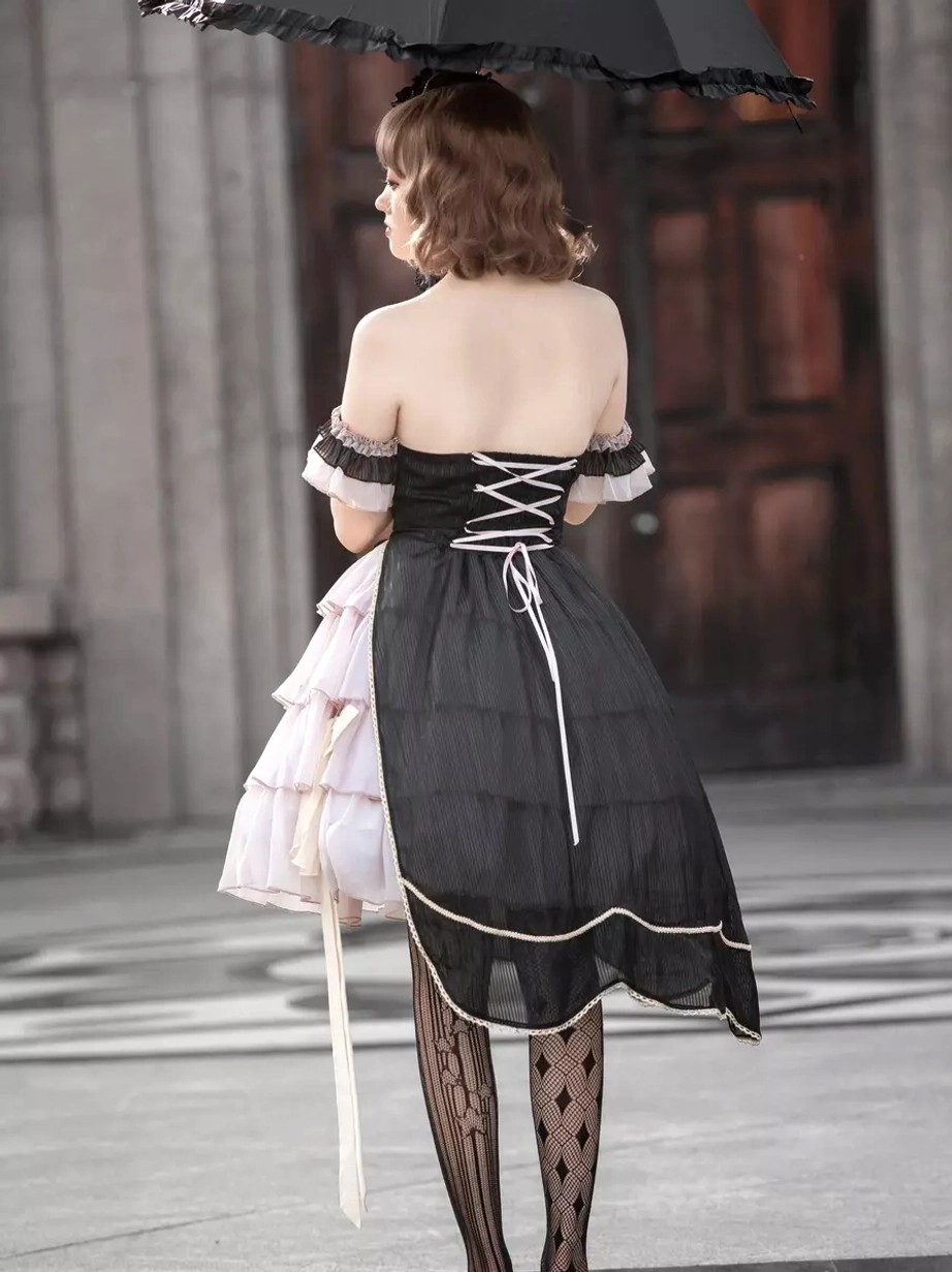 Asymmetrical gothic lolita dress back full-body view female model wooden door background back lace-up corset striped hosiery umbrella above head
