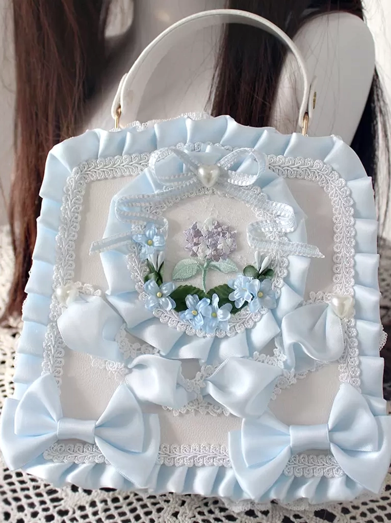 Baby blue sweet lolita PU leather handbag with ruffled satin bows lace trims light floral decor oblique view