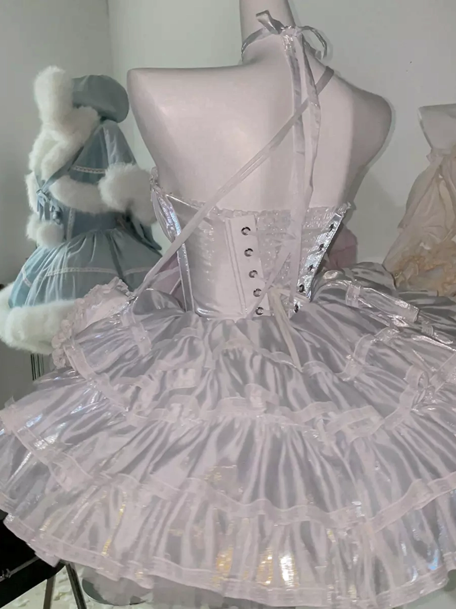 Backless fairy lolita dress rear view featuring lace-up back with metal button details, voluminous tiered ruffle skirt, light blue fur decoration accents