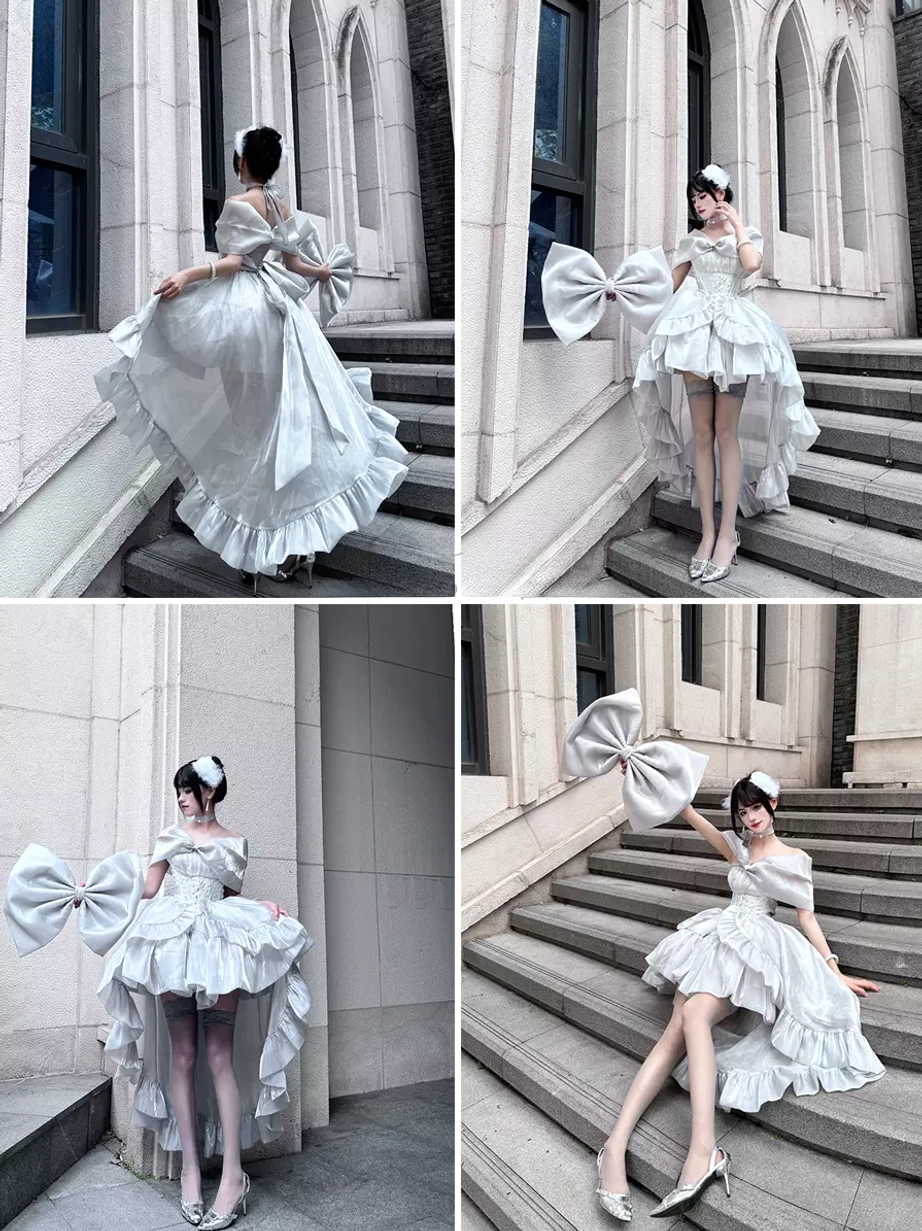 Silver-gray Ballet Hime Lolita dress with detachable oversized bow matching hair accessory on outdoor stone stairs