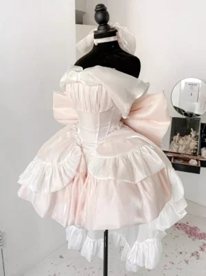Pale pink corset-style sweet Lolita princess dress with large back bow and ruffled trim on mannequin