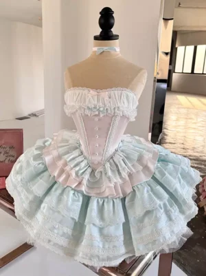 Ballet lolita dress light sky blue front view on dress form displaying tiered tulle skirt with blue-pink ruffled trim