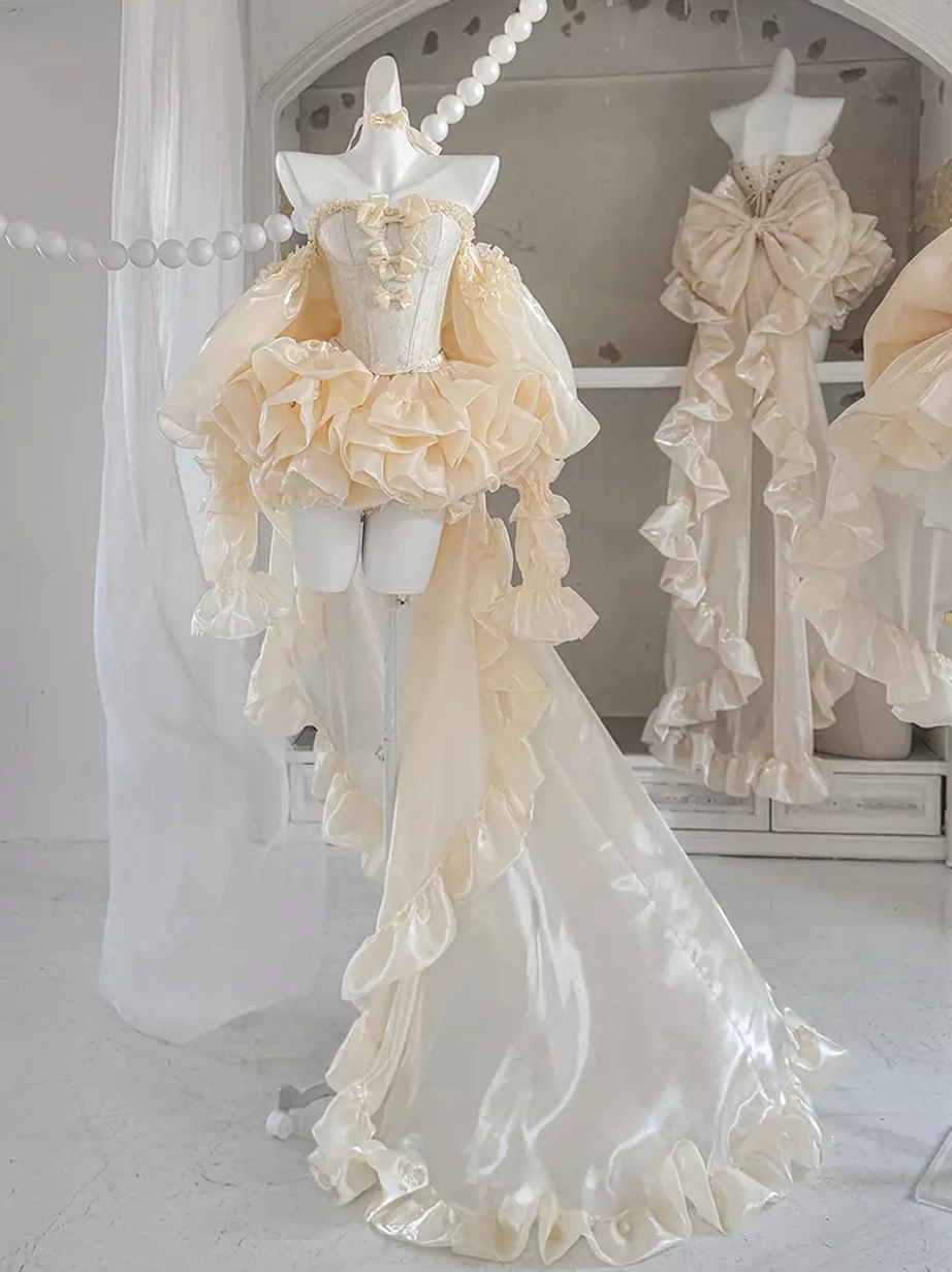 Ballet inspired lolita dress with off-shoulder ruffled top, champagne satin fabric, and dramatic long trailing skirt, side three-quarter view