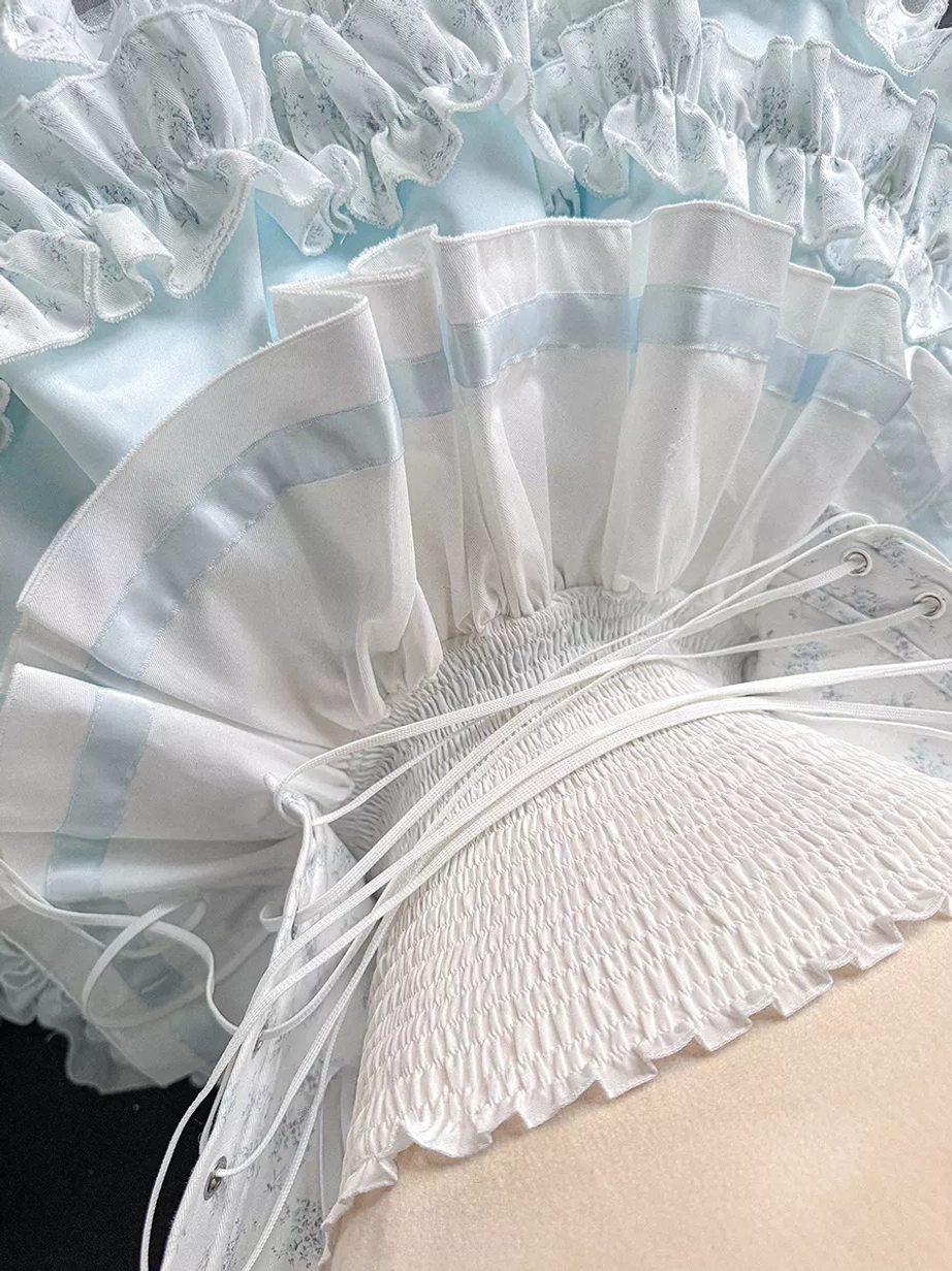 Ballet lolita dress skirt hem close-up detail view showing satin ruffled trim elastic shirred fabric layered tulle structure construction