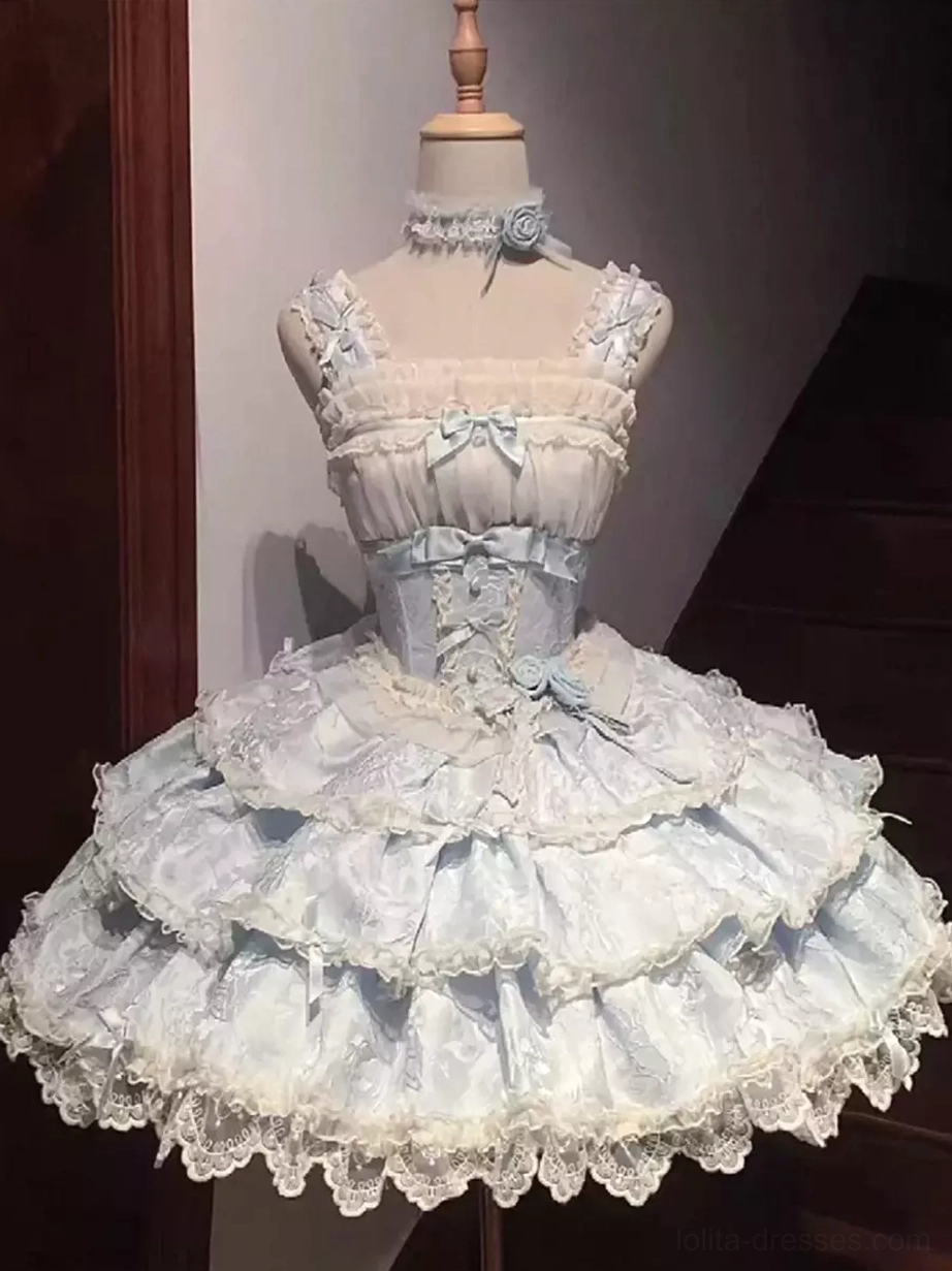 Full front display of light sky blue sweet lolita dress on form featuring square neckline with lace trim, flower choker accessory, and multi-layered ruffle skirt construction
