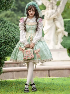 Enchanted garden lolita dress coordinate with floral printed handbag white tights and black mary jane shoes outdoor styling