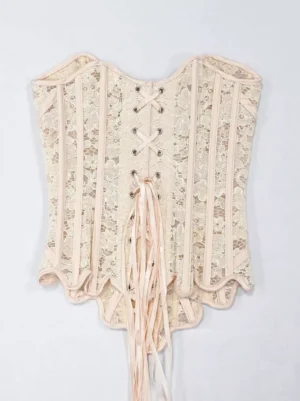 Beige lace corset bustier featuring front lace-up closure with extended ribbon ties and intricate scalloped hem detailing for vintage-inspired romantic style