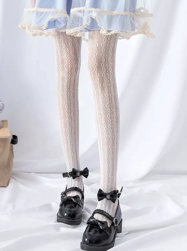 Beige diamond lace mesh lolita tights front low-angle view with blue ruffled skirt and black mary jane shoes