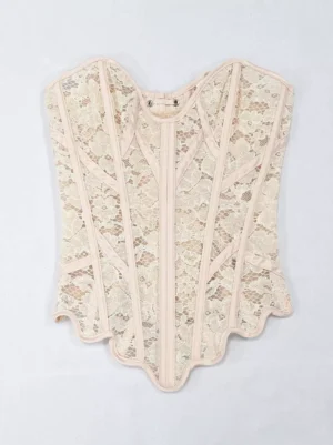 Beige lace overbust corset with sweetheart neckline and scalloped wavy hem, flat lay front view showing detailed floral lace embellishment and romantic bustier design
