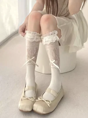 Beige sweet lolita mid-calf socks featuring twisted knit texture, lace ruffle cuff, and white bow embellishments, front leg view coordination