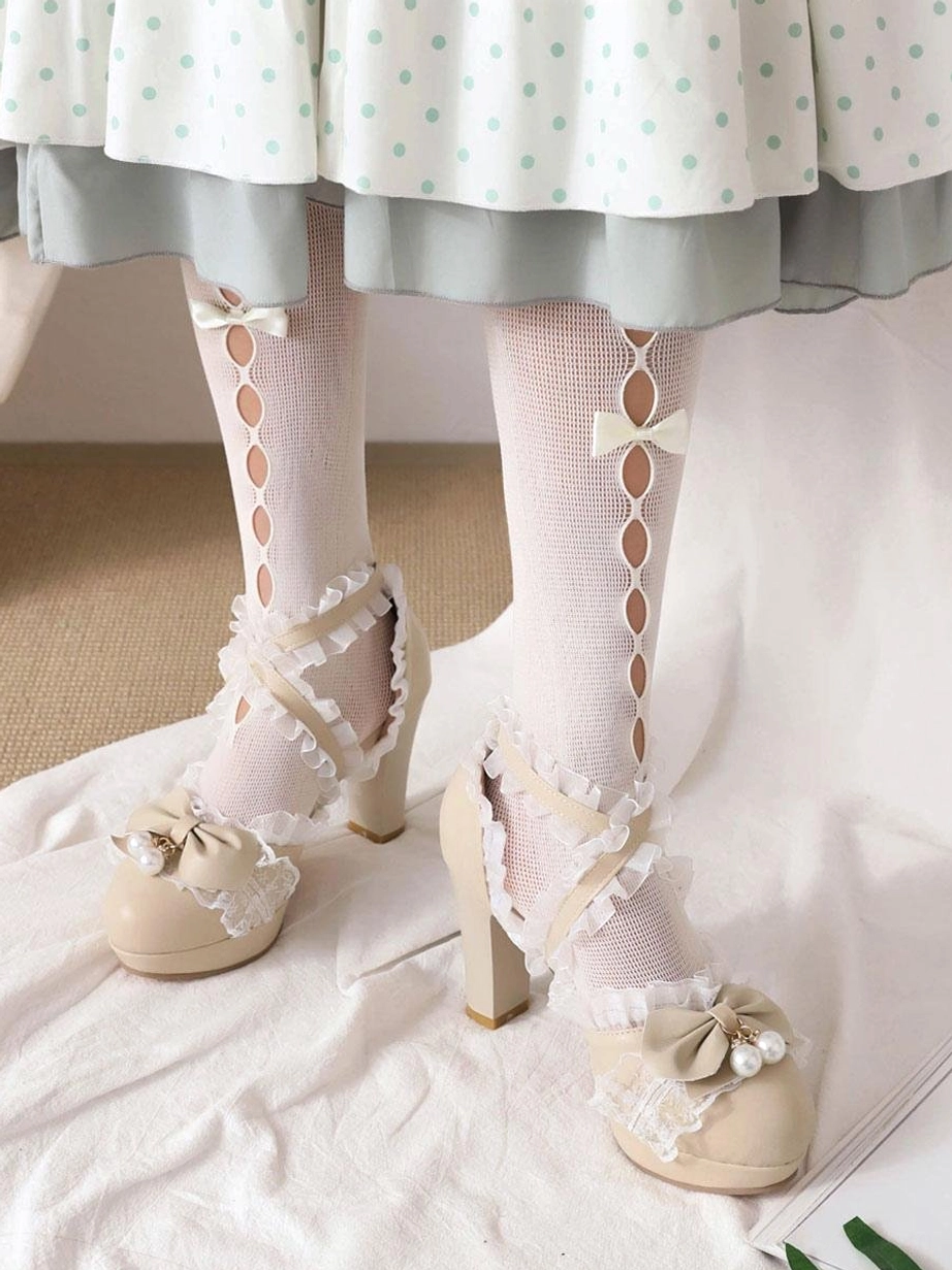 Beige Lolita pumps with cross lace straps bow pearl decoration block heel overhead view worn with hollow-out bow stockings