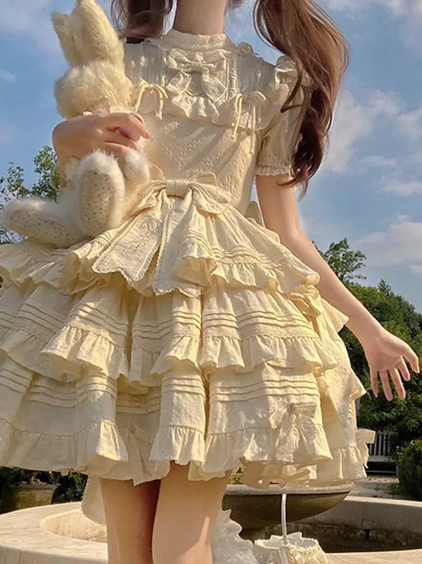 Beige sweet Lolita dress rear back view stand collar ruffled short sleeves waist bow sash multi-layer tiered ruffles