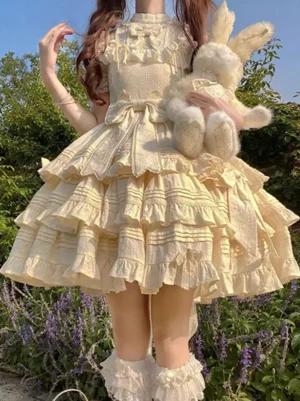 Beige sweet Lolita dress front view short ruffled sleeves tiered skirt ruffles front bows heart embroidery kawaii twin-tails styling