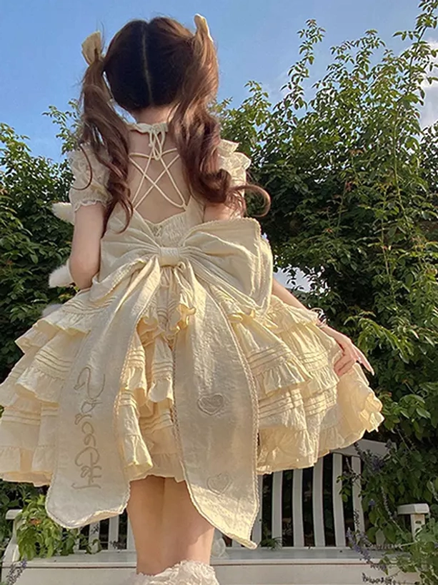 Beige sweet Lolita dress full rear view embroidered large back bow crisscross back strap heart embroidery tiered ruffles