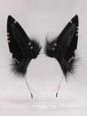 Black furry animal ear headband standalone product view on display stand, close-up showing solid black plush material and gold decorative studs detail for lolita accessories