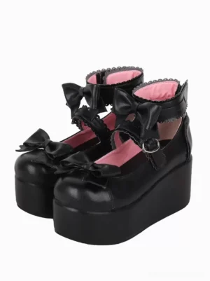 Black butterfly sweet lolita platform sandals with adjustable ankle strap metal buckle and pink lining three-quarter view