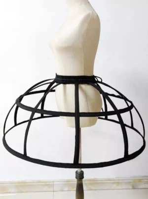 Black cage ball gown petticoat side profile view showing multi-layered ribbed cage construction and silhouette volume for lolita underskirt ensemble