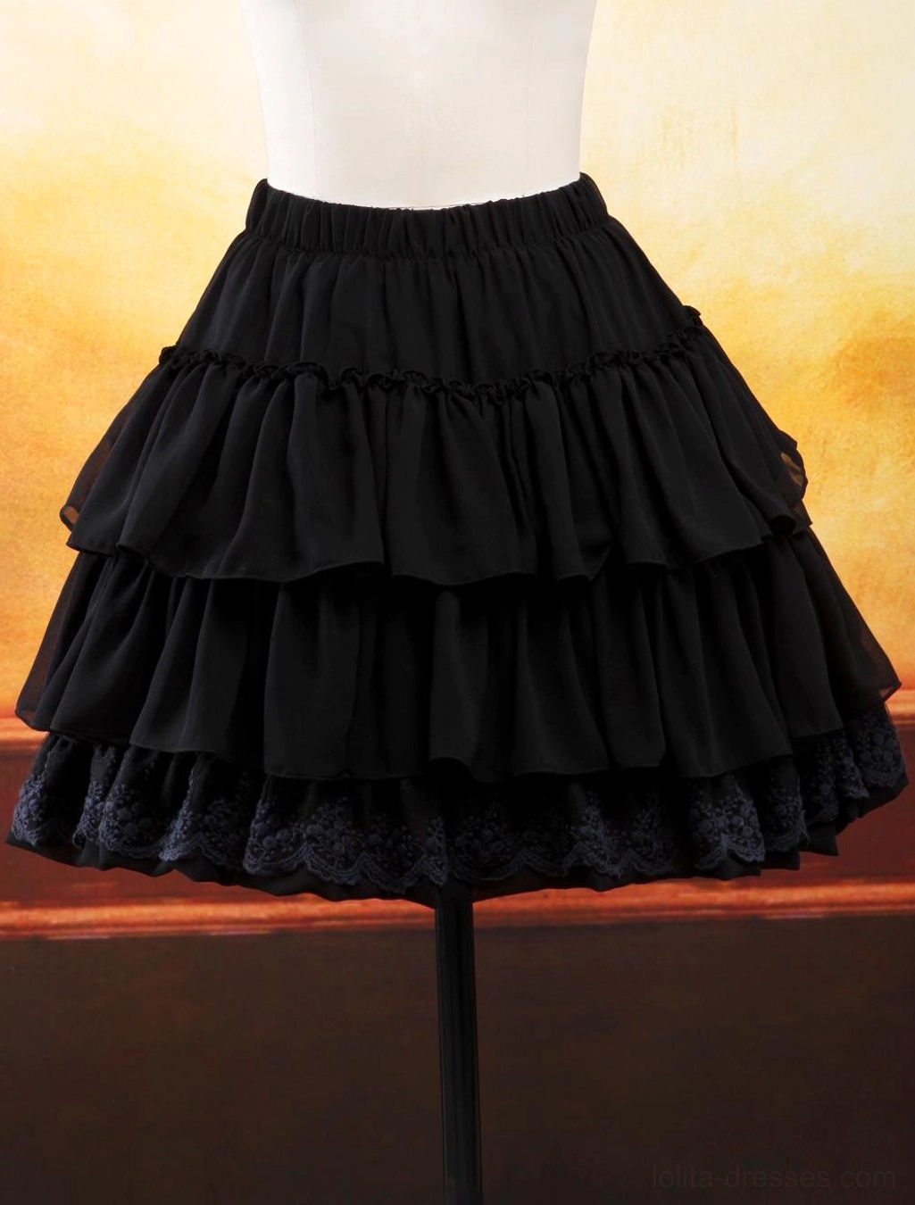 Black chiffon lolita skirt with multiple layered ruffles and lace trim hemline three-quarter front angle on mannequin showing elegant drape and ruffle detail