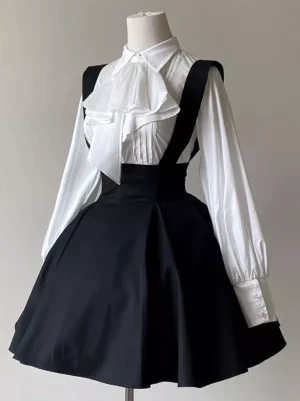 Black classic lolita suspender skirt front view on dress form with high-waisted flare and ruffled neck bow detail