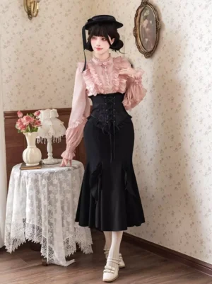 Gothic lolita black corset waist fishtail skirt full body side view with coordinating pink blouse and vintage home setting