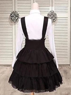 Black cotton classic lolita salopette dress back view mannequin showing adjustable shoulder straps tiered ruffle skirt hem cascading layers gothic romantic style