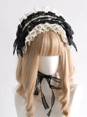 Black and cream lace lolita headdress with ruffled bow front flat view on mannequin wearing blonde wig showcasing sweet lolita style