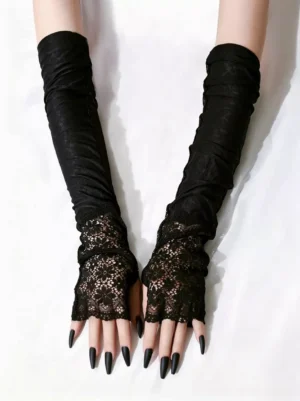Black fingerless lace long gloves overhead view with floral lace cuffs and stretchy fabric design on arms with black nail polish
