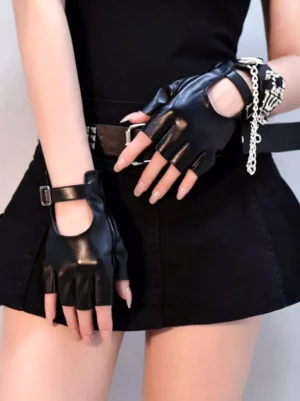 Black fingerless leather gloves worn with gothic lolita outfit featuring half-finger cut design and metal wrist buckle detail on model in all-black punk ensemble