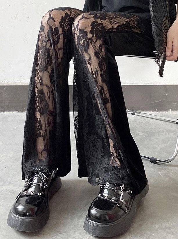 Black flared lolita trousers, front seated view, dual-style construction, sheer lace outer layer solid velvet inner, metal chair styling