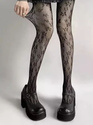 Black floral lace lolita pantyhose full leg view front angle showing delicate hollow-out pattern with platform mary jane shoes