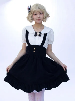 Black floral ruffled lolita skirt with suspender details front view on blonde model wearing white peter pan collar blouse and gold buttons